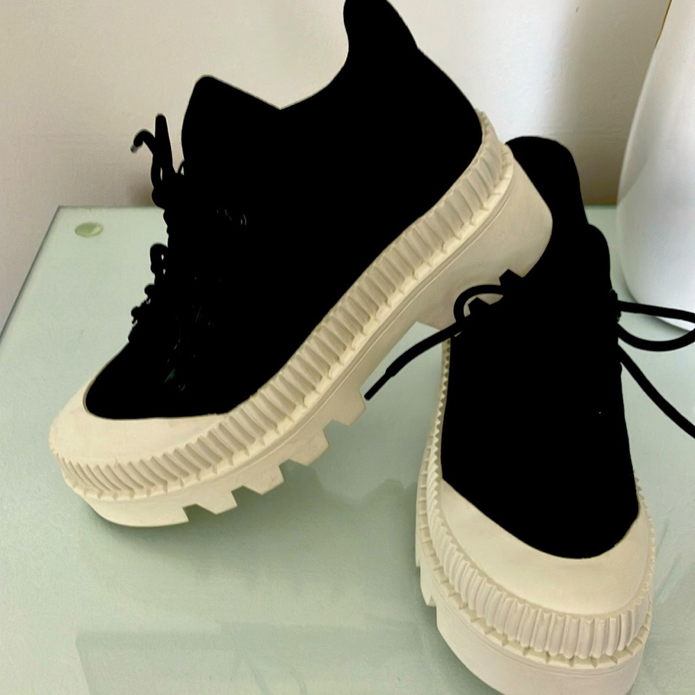 Black lug sole sneaker. Never worn. Silent D